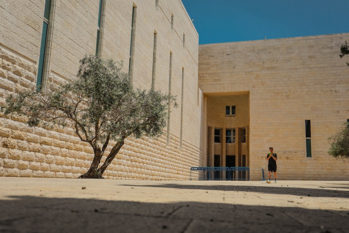 A pedestrian outside Israel’s Supreme Court, Jerusalem
